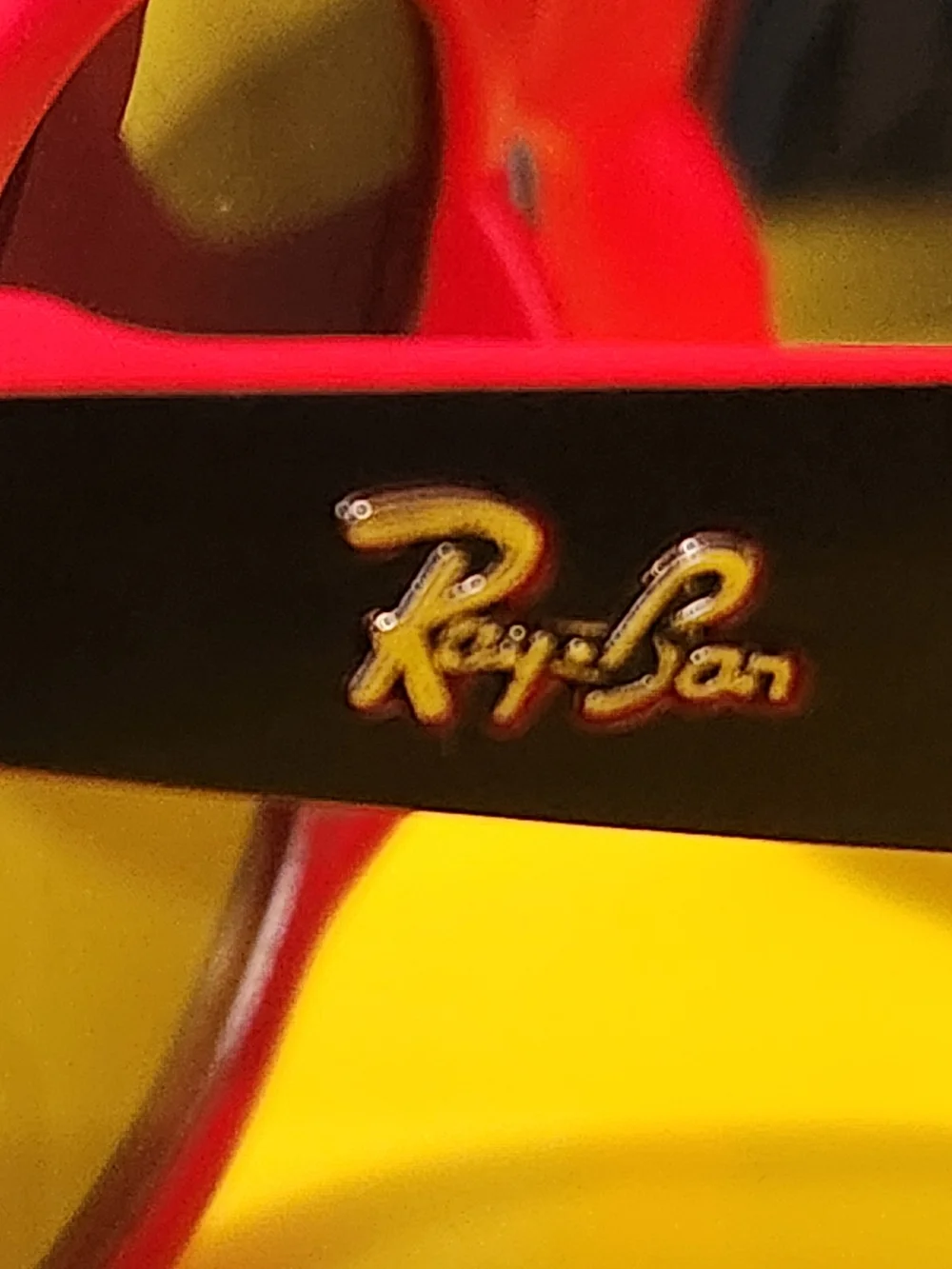 Black Frame Sunglasses with Red Trim and Yellow Lenses